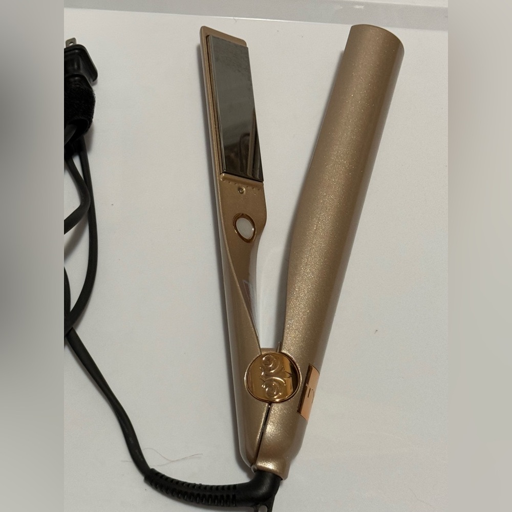 TYME Iron Pro 2-in-1 Hair Curler and Straightener in rose gold.